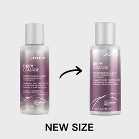 Joico Defy Damage 2 oz bottle next to a coin for scale to show compact travel-friendly size
