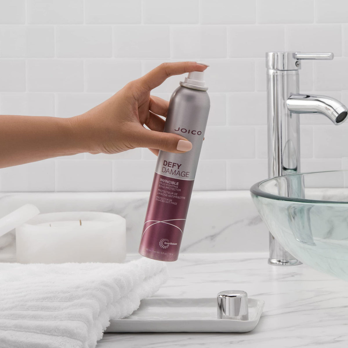 Joico in-hand size comparison highlighting travel-friendly 180mL bottle
