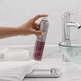 Joico in-hand size comparison highlighting travel-friendly 180mL bottle