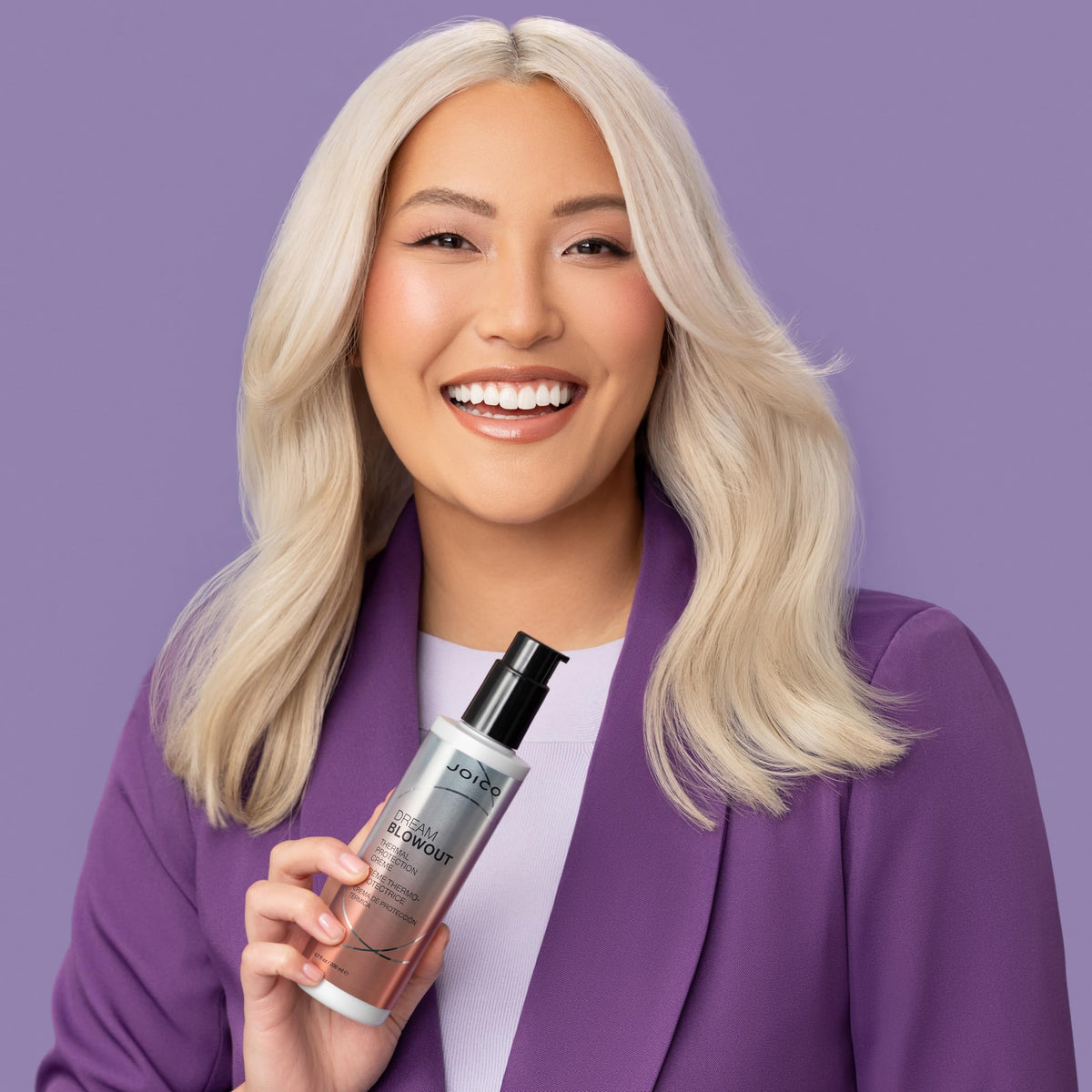 Joico bottle in hand for size comparison, indicating travel-friendly 6.7 fl oz