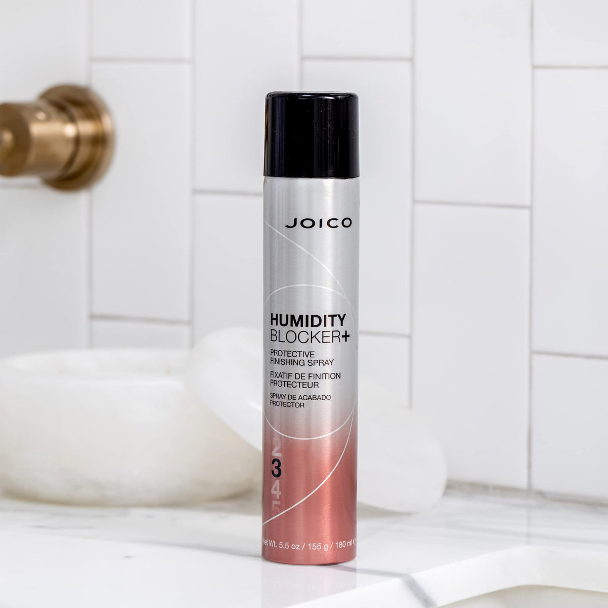 Joico applied on finished blowout to reduce frizz and boost shine