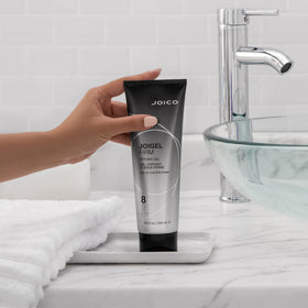 Joico JoiGel Firm used during blow-dry showing heat protection and styling help