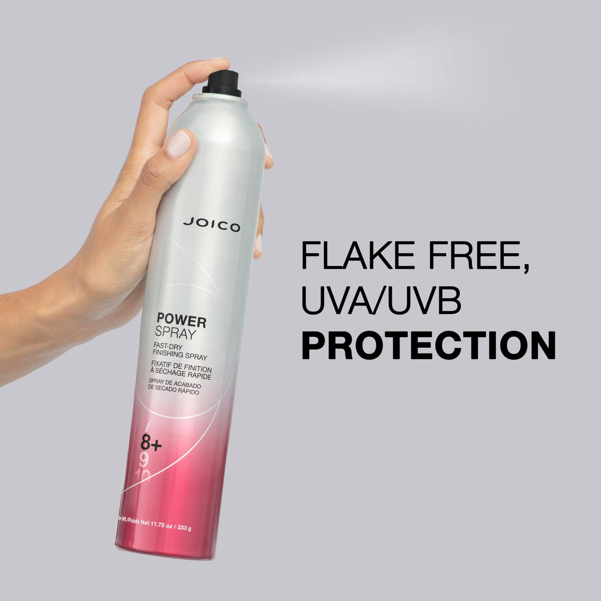 Hand holding Joico Power Spray to show 11.75 oz scale and travel-friendly size