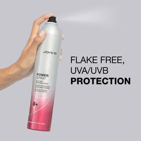 Hand holding Joico Power Spray to show 11.75 oz scale and travel-friendly size