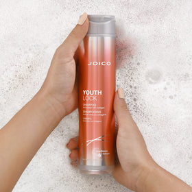 Joico YouthLock shampoo on bathroom shelf conveying salon-quality routine