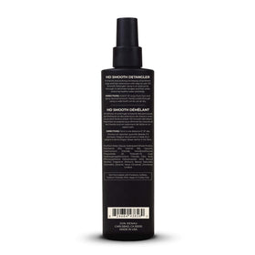 Jon Renau detangler displayed on a vanity with a wig, illustrating daily maintenance ease