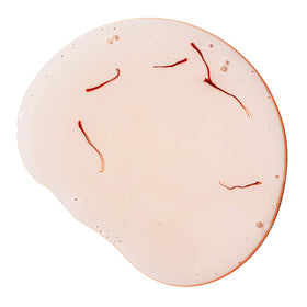 Applying Joon oil to hair ends to smooth frizz and add shine during styling