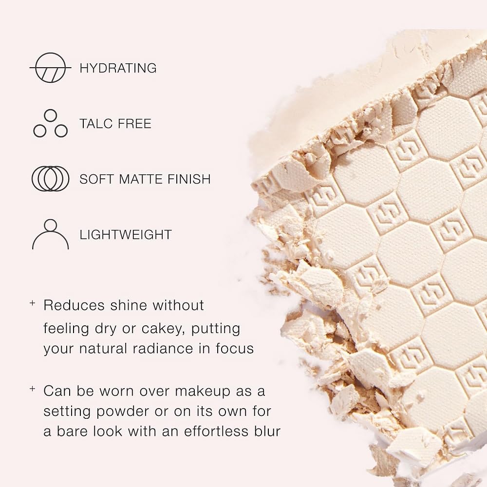 Jouer compact held in hand to show size and travel-ready benefit