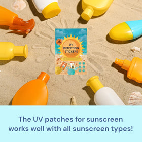 joyful artistry family on beach using stickers as sun protection reminders