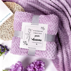 Joyvella bath bomb and salts staged for a relaxing soak experience