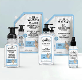 J.R. Watkins refill pouches beside standard dispenser to show scale