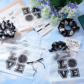 Juexica team giveaway spread on bench showing coordinated black and white favors