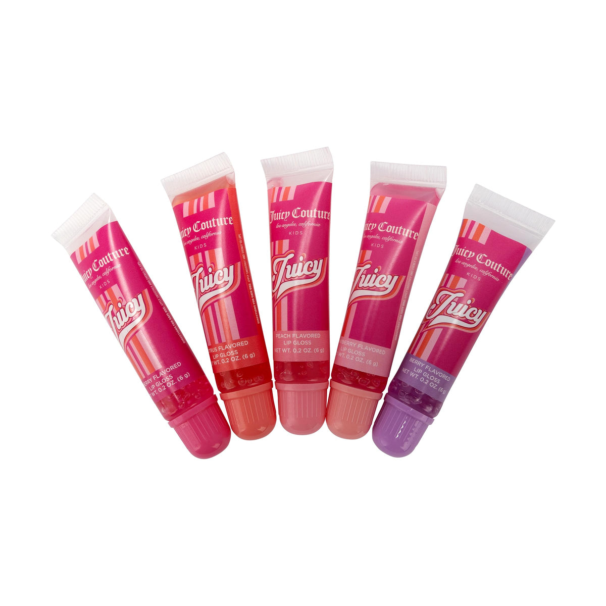 Juicy Couture gloss set styled as a gift on a vanity conveying playful presentation