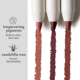 Julep liner held between fingers to show size and travel-friendly retractable design