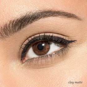 Julep Clay next to ruler showing pencil size and travel-friendly benefit