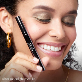 Julep application on eyelid closeup showing crease-proof shimmer and even coverage