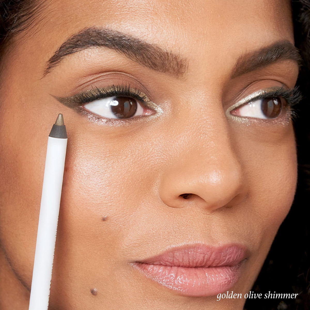 Model eye lined with Julep Golden Olive Shimmer showing longwear definition