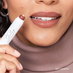 Julep swatches on arm displaying buildable 90's neutral shades and coverage