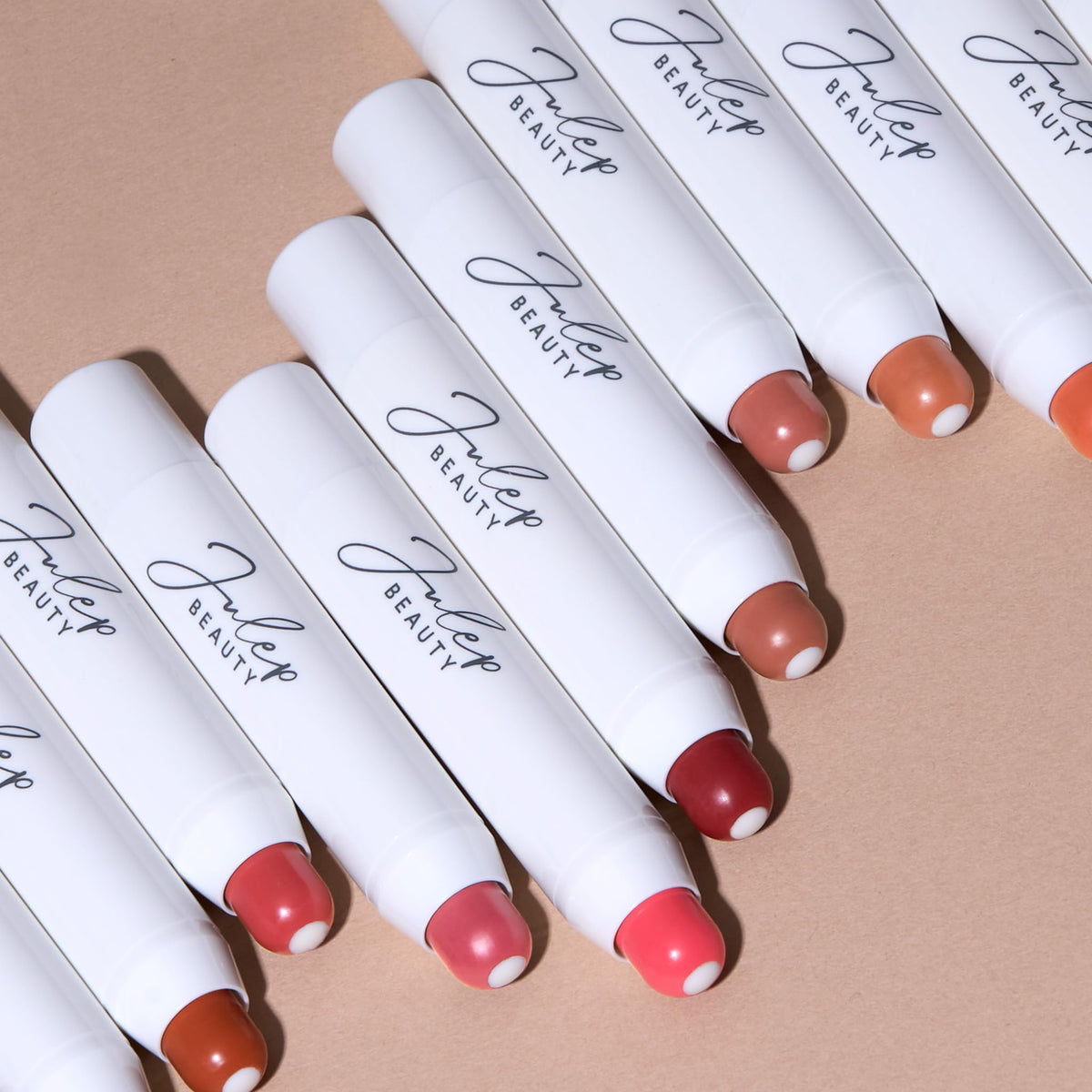 Julep balm styled in travel pouch showing convenience for on-the-go touch-ups