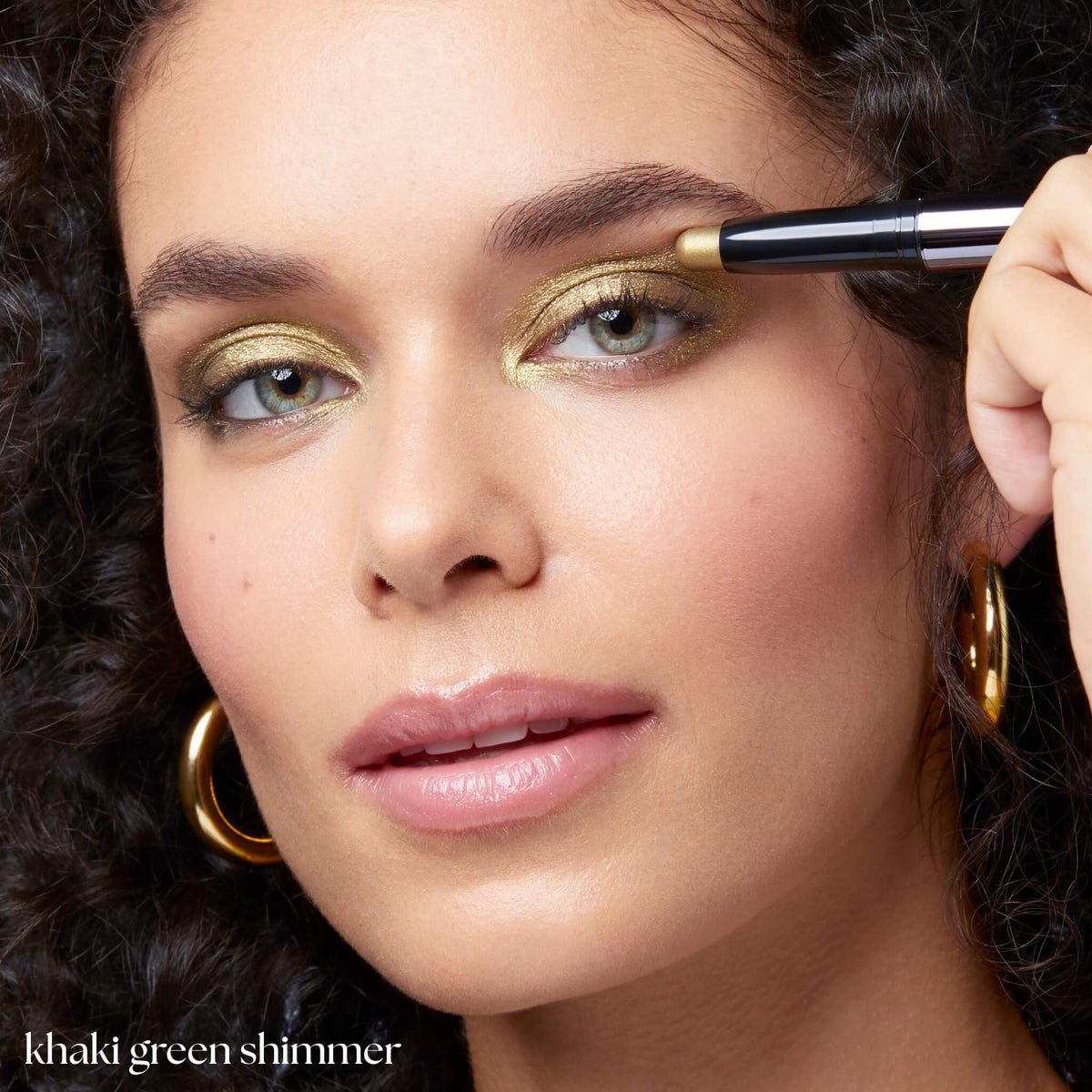 Julep lifestyle image of model wearing khaki green shimmer for versatile glow