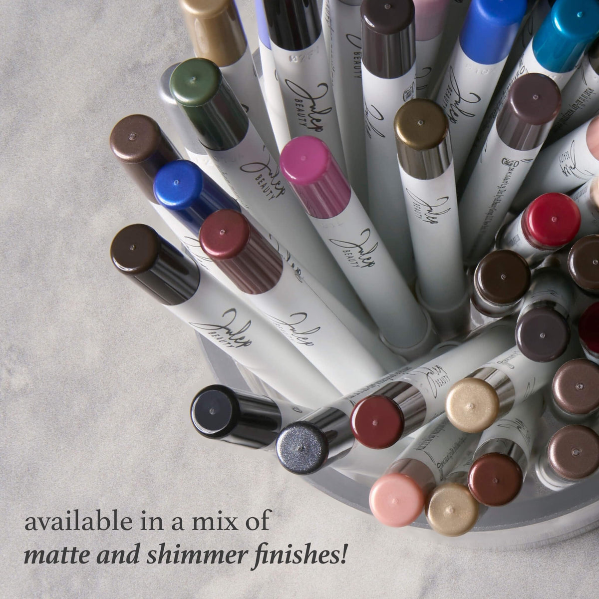 Julep pencil held in hand for scale and convenient portability