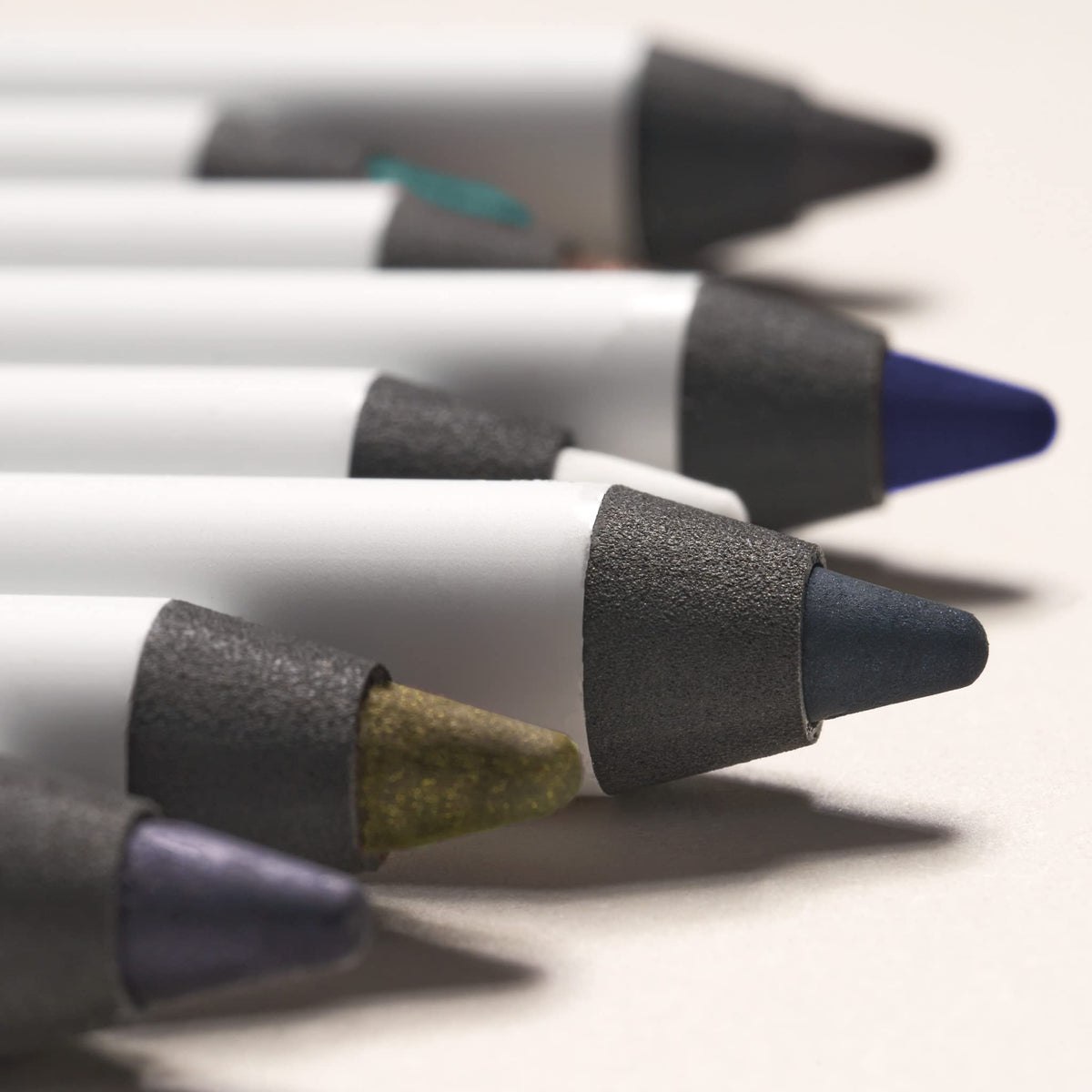 Julep pencil on vanity with brushes suggesting everyday routine and polished finish