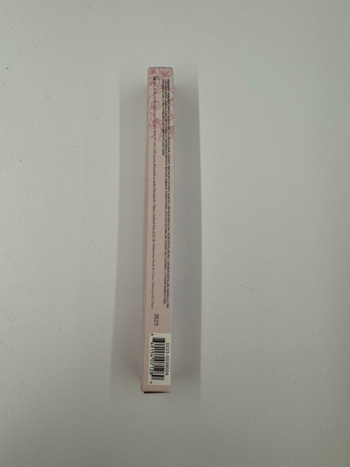 Julep lip liner next to a pen showing size and portability benefit