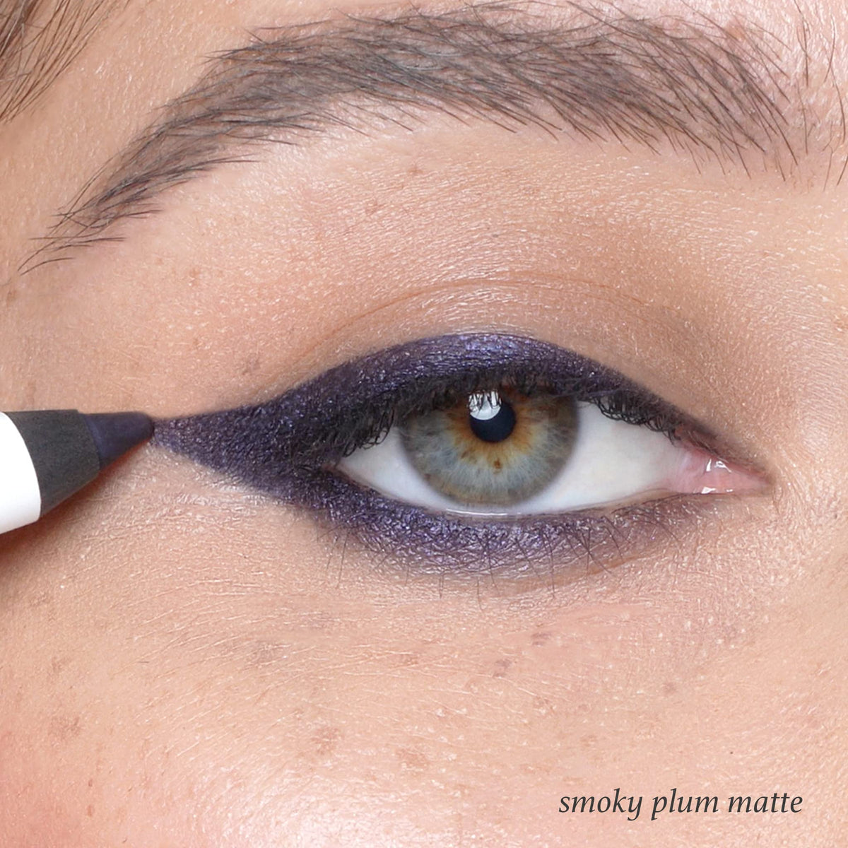 Julep Smoky Plum swatch on arm illustrating rich pigment benefit