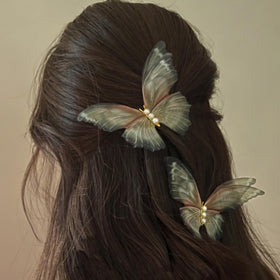 Jumwrit front view of green butterfly clips showing elegant design and secure hold