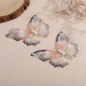 Jumwrit butterfly clip worn in half-up hairstyle adding boho charm and stability