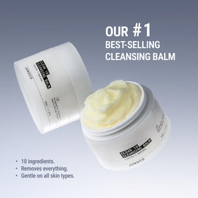 JUNO & Co. balm warming between hands to show silky oil conversion and easy spreadability