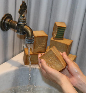 JUSIZA aleppo soap resting on draining dish illustrating proper storage