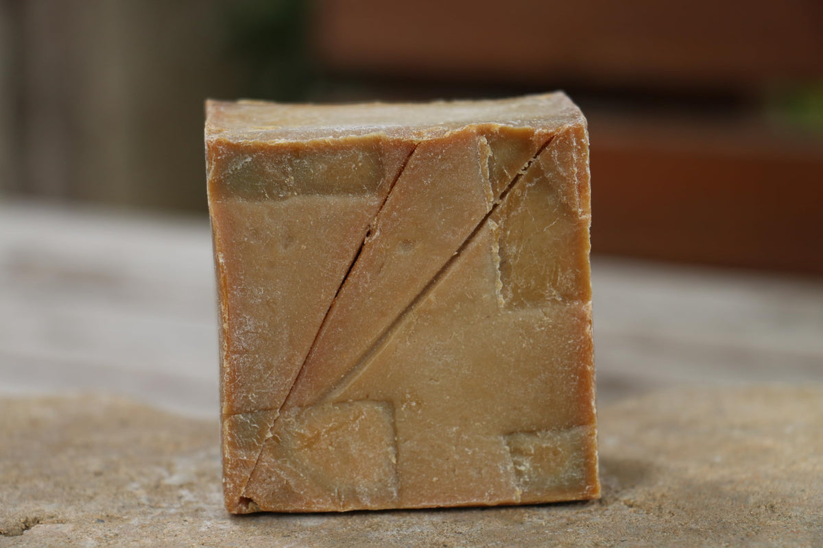 JUSIZA close-up of bar texture highlighting handmade surface and moisturizing quality