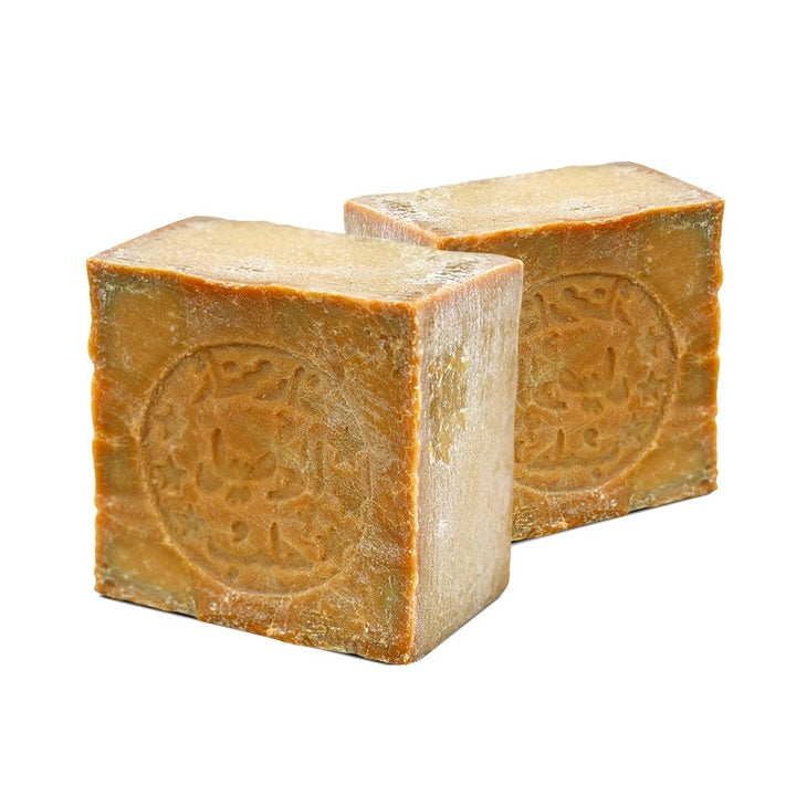 JUSIZA front-packaging showing two olive oil Aleppo bars with clear labeling and natural appeal