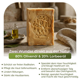 JUSIZA bar lathered in hand, demonstrating gentle foam and easy cleansing