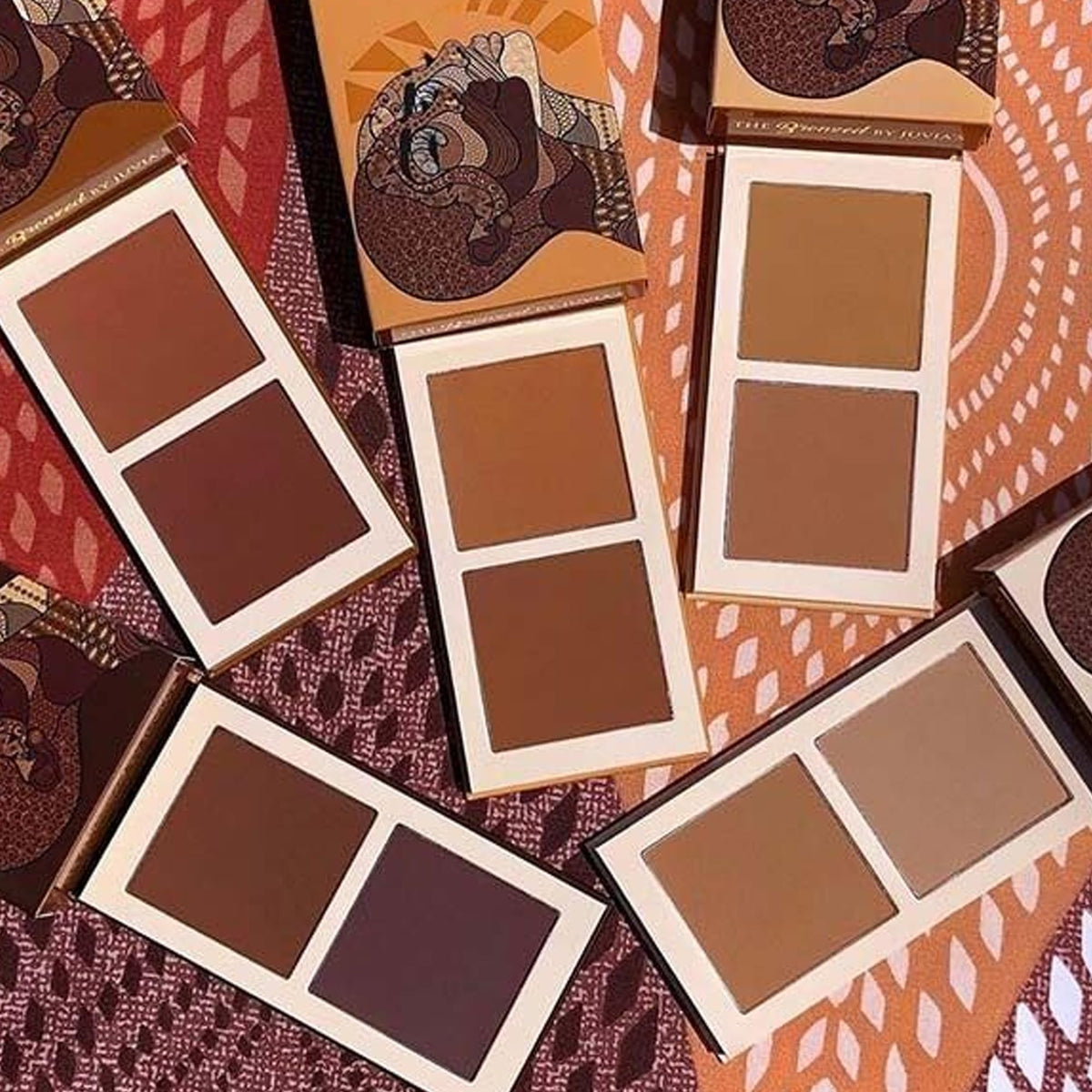 Juvia's Place bronzed duo inside a makeup bag ready for touch-ups and travel convenience
