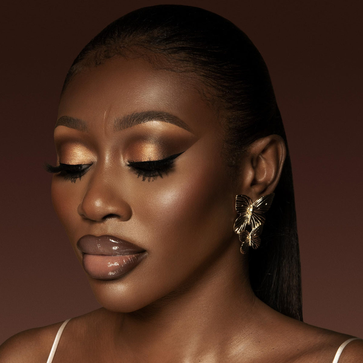Juvia's Place on model lips showing Brown Sugar tint and flattering finish benefit