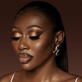 Juvia's Place on model lips showing Brown Sugar tint and flattering finish benefit