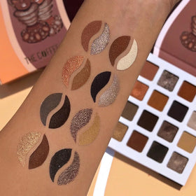 Juvia's Place palette peeking from makeup bag in lifestyle setting for everyday use