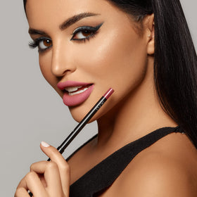 K7L lipliner next to clutch in lifestyle shot showing travel-friendly reliability