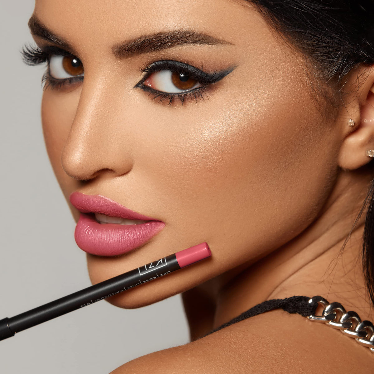 K7L lip crayon inside a clutch portraying everyday wearability and style