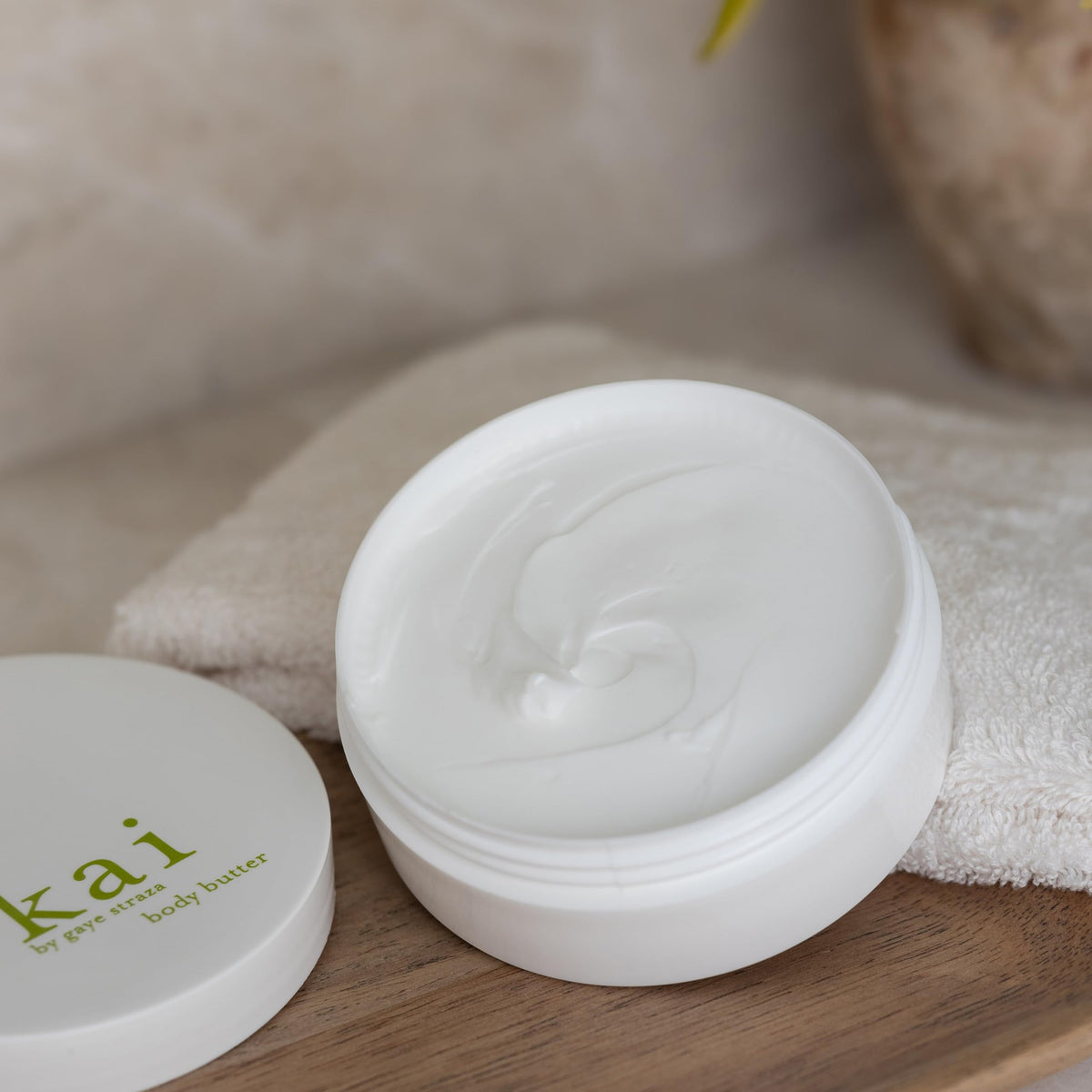 kai body butter being smoothed on arm demonstrating quick absorption and non-greasy feel