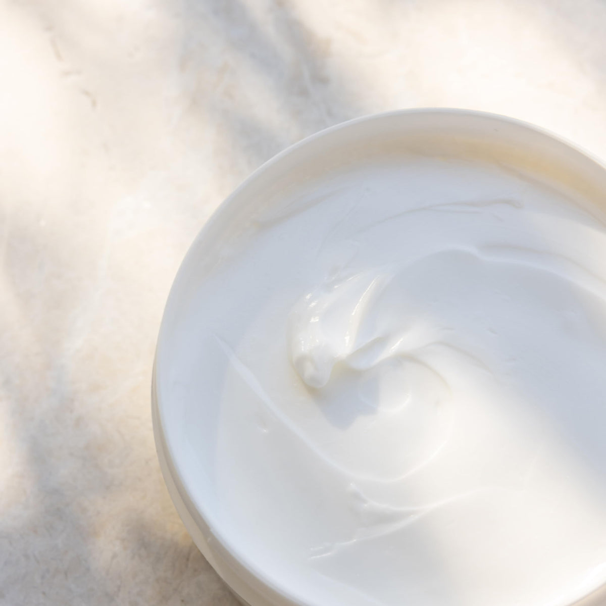 kai product staged with gardenia blooms suggesting fragrant white-exotics and fresh scent