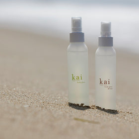 kai bottle next to phone showing 4 fl oz size and travel-friendly benefit