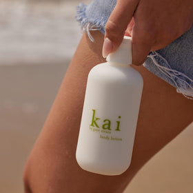 kai applying lotion to forearm demonstrating quick absorption and smooth finish