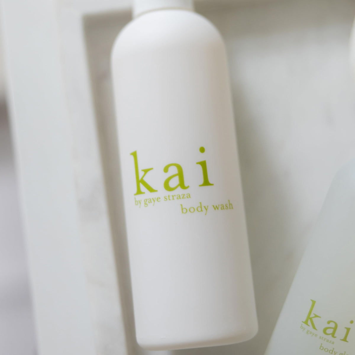 kai body wash in shower setting, demonstrates fresh scented use