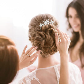 KALOLIA worn by bride in soft updo illustrating elegant finishing touch
