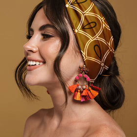 Karma bee headband worn by model outdoors showing steady hold benefit