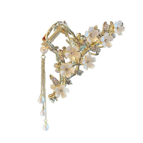 Kemmintvn front view of gold lily clip showing floral design and crystals for elegant styling
