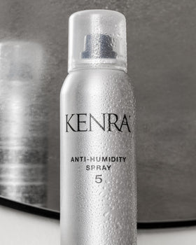 Kenra anti-humidity spray 5 held in hand showing compact 5oz size